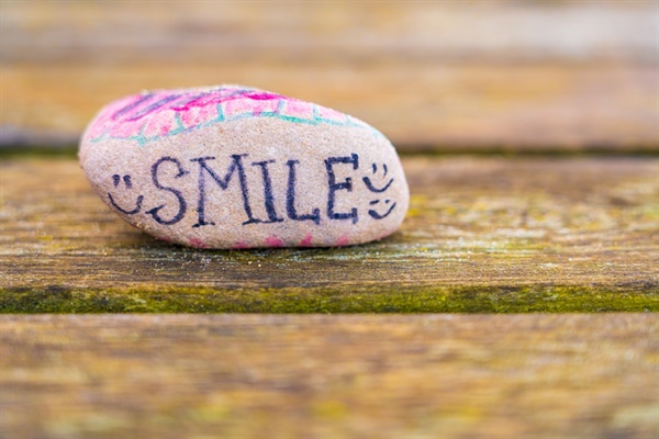 Taoism rock with the word Smile